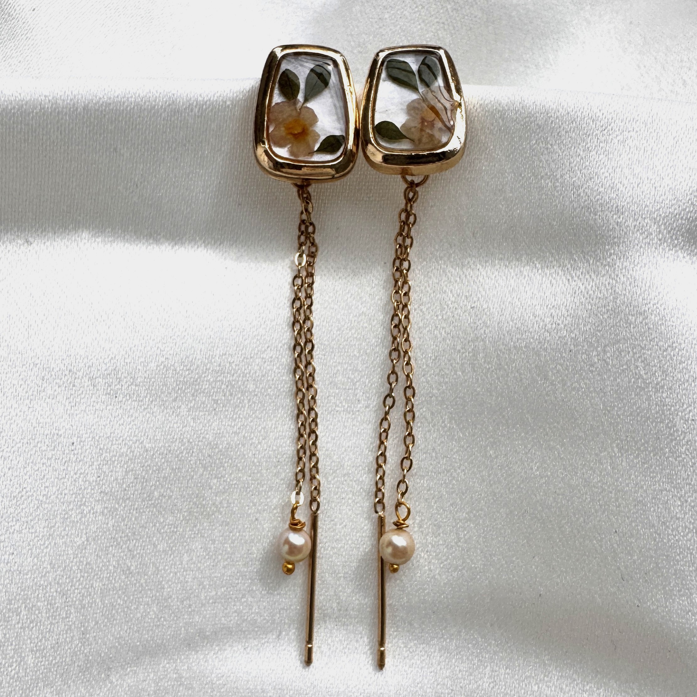 Elegant Bloomthread threader earrings with floral studs, twin gold chains, and pearl drops.