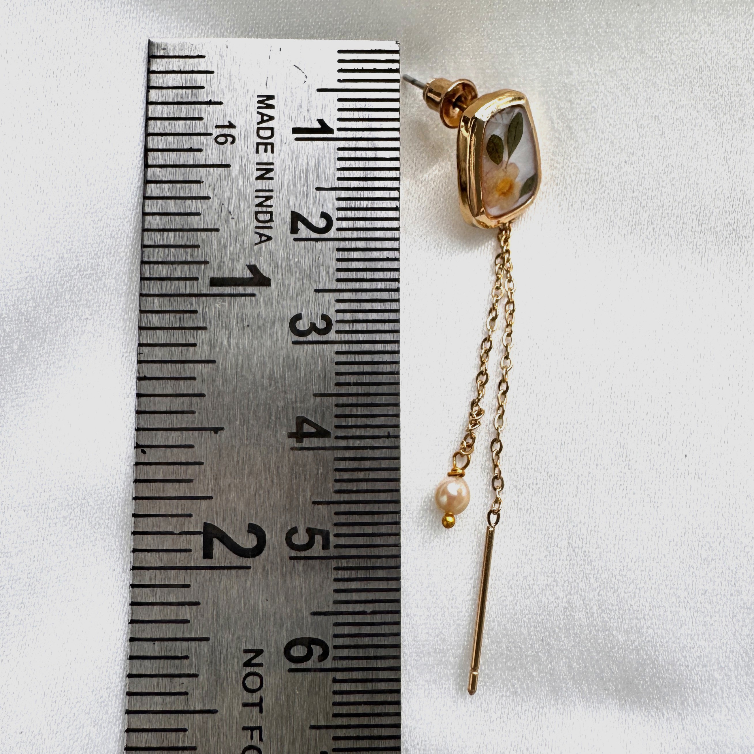 Elegant Bloomthread threader earrings with floral studs, twin gold chains, and pearl drops.